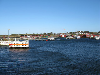 Fototapeta na wymiar Laesoe / Denmark: View from the port entrance to the small fishing port in Vesteroe Havn