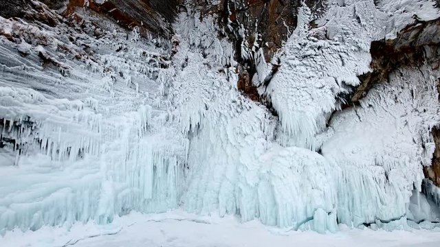 Aerial Approach unique splashes white ice sharp texture cliff mountain rock beautiful surface coastal drawing Travel Winter cold snow icy. Wild innocent Baikal FIFA Russia North Arctic. Drone 