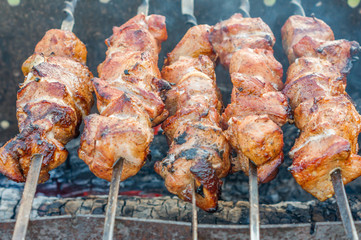 closeup of grilled meat on bbq outdoors.