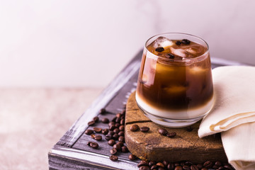 Iced coffee in glasses with milk. Black background