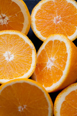 Oranges composition close up colored photo with drops of wet