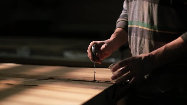 Handmade work on the manufacture of furniture from wood. epoxy in the cracks.