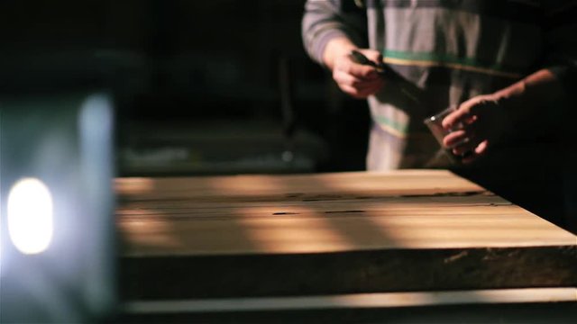 Handmade work on the manufacture of furniture from wood. epoxy in the cracks.