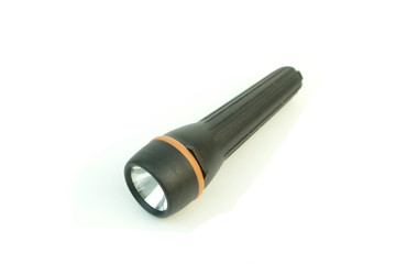 The electric flashlight. Plastic. Photo on white background.