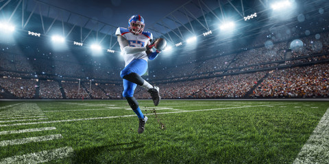 Fototapeta na wymiar American football player performs an action play on professional sport stadium