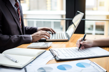 Co working conference, Business team meeting present, investor colleagues discussing new plan financial graph data on office table with laptop and calculator, Finance, accounting, investment