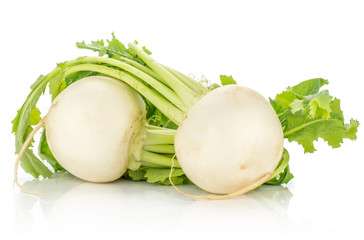 Two white radish bulbs with leaves isolated on white background.