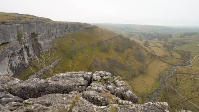 A panning shot from the top of Malham Cove in the Yorkshire Dales, England, UK.