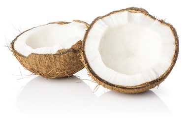Two coconut section halves isolated on white background one broken in two brown fibrous shell with milk meat.