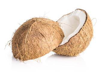 One sliced coconut two halves isolated on white background brown fibrous shell with milk meat.