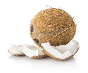 One coconut with three broken pieces isolated on white background brown fibrous shell with milk...