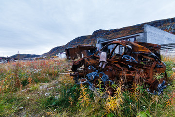 abandoned car in the remote village of Teriberka, Kola Peninsula, Russia