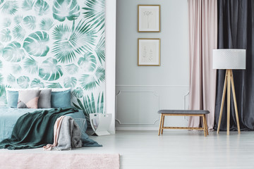 Green bedroom interior with leaves