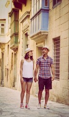 Fototapeta na wymiar Young romantic couple tourists walking in Valletta, Malta