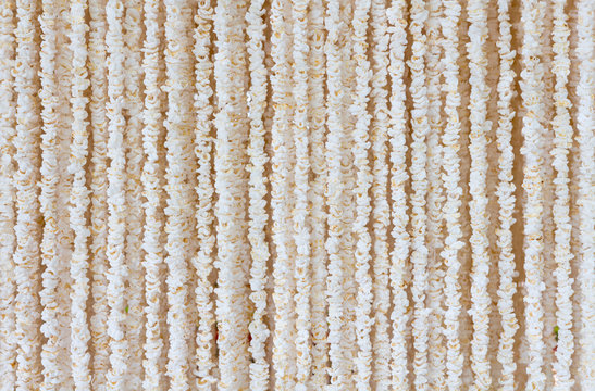 Garlands made of popped rice of Thailand, the Buddhist in the northeast of Thailand.he Garland popped to worship the Prophet of Buddhism