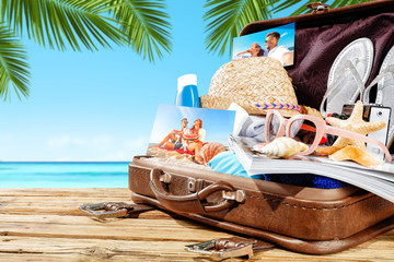 summer suitcase and beach background 