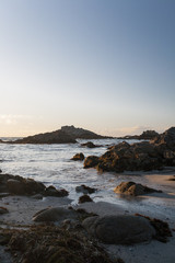 Fototapeta na wymiar Sunset on a beach in Monterey, California