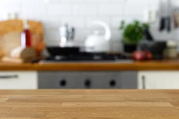 Foto op Aluminium Empty wood counter in front of out of focus home kitchen background. © Moving Moment