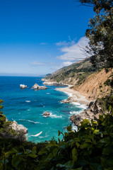 Fototapeta na wymiar Big Sur National Park, California and Waves Breaking in the Distance on a Rocky Coastline Shore