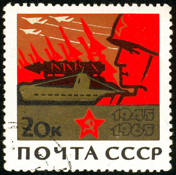 Ukraine - circa 2018: A postage stamp printed in USSR show Soldier and machines of war. Series: 20th Anniversary of Victory in the Second World War. Circa 1965.