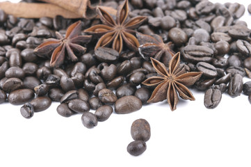 anise and cinnamon in coffee beans heap  on white background