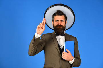 Man in white hat with black halo around head