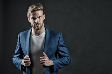 Young handsome man in blue suit