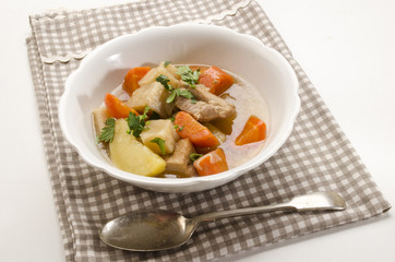 delicious home made irish stew in a white bowl