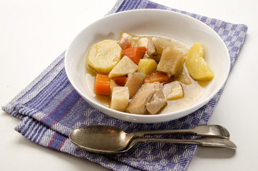 classic irish stew with a spoon and deep plate