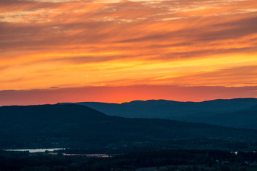 Burning sunset mountain silhouette