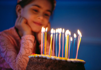 Portrait of little pretty girl with birthday cake