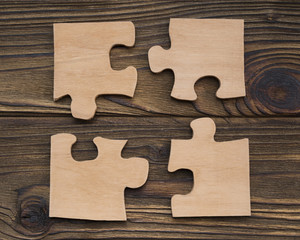 Four pieces of the puzzle are assembled into one. Business concept idea, cooperation, teamwork, strategy