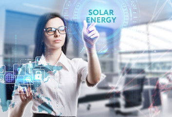 The concept of business, technology, the Internet and the network. A young entrepreneur working on a virtual screen of the future and sees the inscription: Solar energy