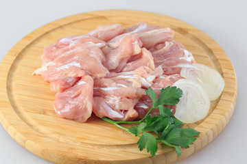 raw chicken goulash on white background