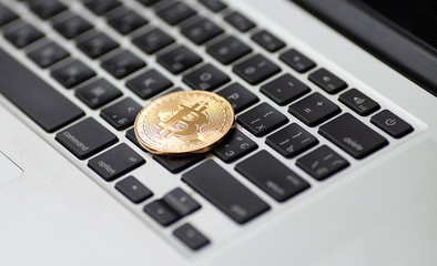 bitcoin on laptop keyboard