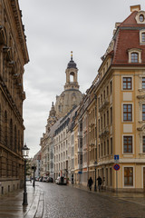 Fototapeta premium Street view in city of Dresden with Church of our Lady in the Background