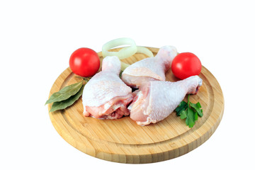 raw chicken legs on a white background