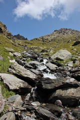 Fototapeta na wymiar Little waterfall with brook in the Italian Alps (Alpi Orobie, Pizzo Coca)