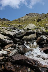 Fototapeta na wymiar Little waterfall with brook in the Italian Alps (Alpi Orobie, Pizzo Coca)