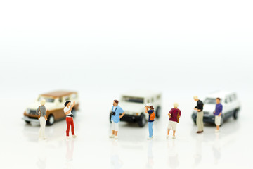 Miniature people : Businessman standing with car. Image use for Advertising product in the market today, competition on the business trading. © polymanu