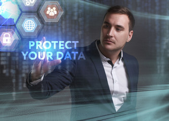 Obraz premium Business, Technology, Internet and network concept. Young businessman working on a virtual screen of the future and sees the inscription: Protect your data