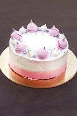 Cake decorated with pink meringues.  Cake for a girl