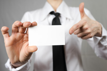 Businesswoman holding a business card. Mock up. Copy space.