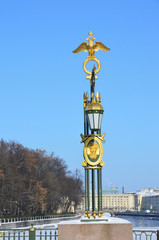 Fototapeta na wymiar Опора освещения Пантелеймоновского моста со златоглавым орлом в Санкт-Петербурге