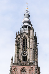 Clock tower of  the big church  in the  city center of Amersfoort Netherlands