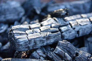 Black charcoal texture background selective focus