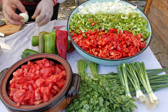 Hands Cut Vegetables Ready For Cooking, Variety Of Vegetables, Bulgarian Flag Vegetables Background. Prepare Sterilize Vegetables. Diagonal Composition In Picture. Organic Tomatoes, Peppers And Onions