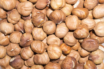 background - peeled ripe hazelnut kernels closeup