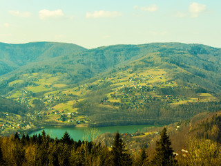 The lake is surrounded by mountains. Spring nature    