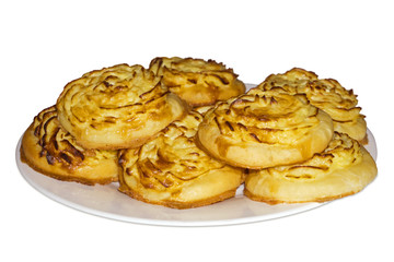 Obraz na płótnie Canvas Shangy (plural form of shanga) - traditional Ural open baked pies with mashed potatoes - on a plate, isolated on white background